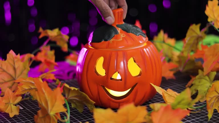 Putting light in jack o lantern pumpkin, Halloween decor