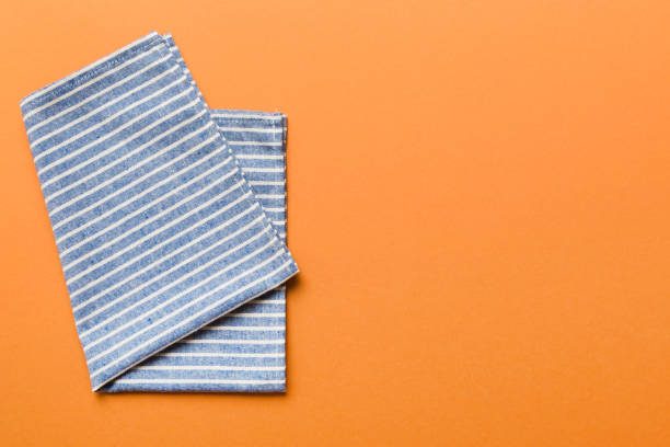 istock top view with blue kitchen napkin isolated on table background. Folded cloth for mockup with copy space, Flat lay. Minimal style 2149956715