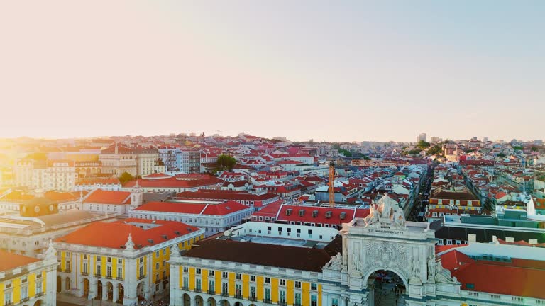 Aerial view of Lisbon, Portugal. View of famous Augusta Arch, Commercial square, and Tagus river at sunset.Horizontal shot