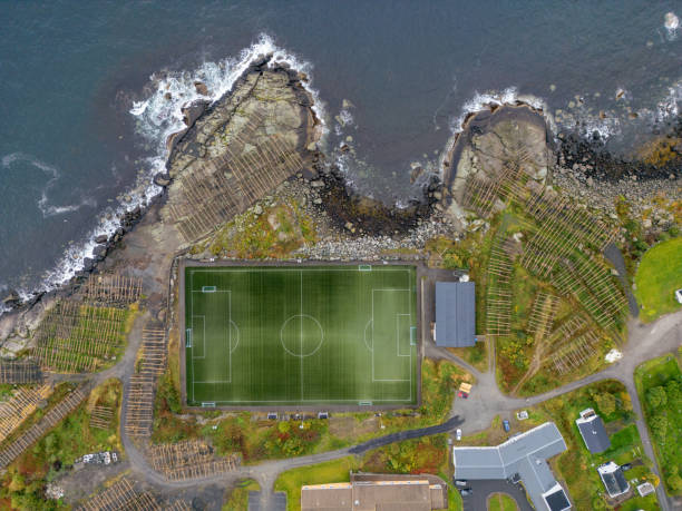 istock Drone View of Soccer Field and Fish Drying Racks 2149958836