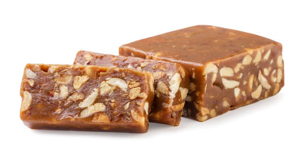 istock Caramel sherbet with nuts cut into pieces on a white background. Isolated 2149959058
