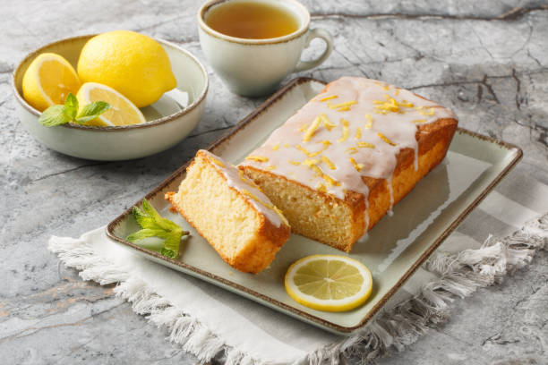 istock Homemade glazed lemon pound cake closeup on the plate served with tea. Horizontal 2149959207