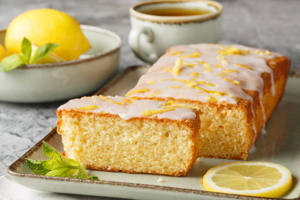 istock Glazed lemon pound cake loaf with lemon zest closeup on the plate. Horizontal 2149959234