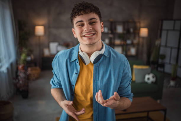 istock A cheerful teenager makes a video for his vlog 2149960036