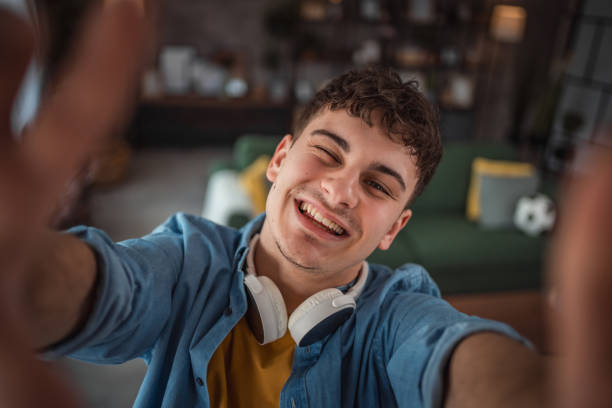 istock A cheerful teenager makes a video for his vlog 2149960041