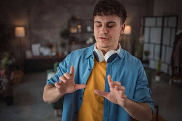 istock A cheerful teenager makes a video for his vlog 2149960088