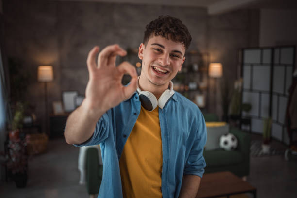 istock A cheerful teenager makes a video for his vlog 2149960113