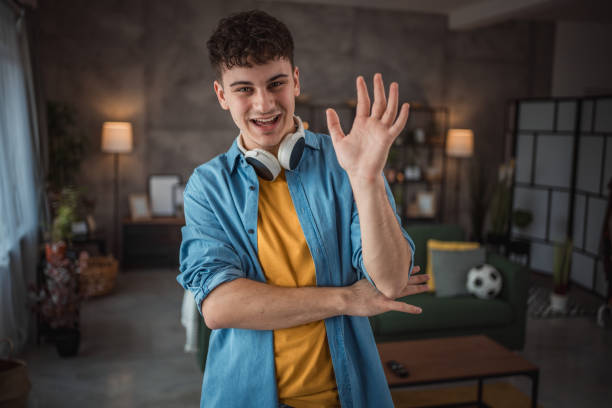 istock A cheerful teenager makes a video for his vlog 2149960118