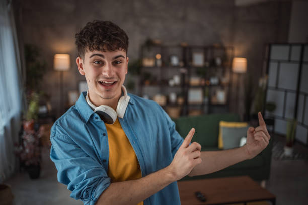 istock A cheerful teenager makes a video for his vlog 2149960130