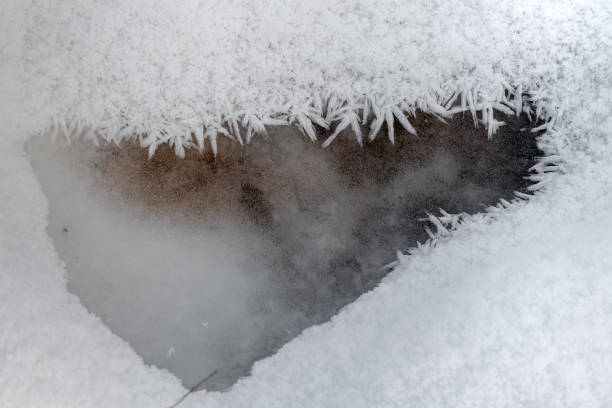 istock Ice crystals on the ground in the winter. 2149961083
