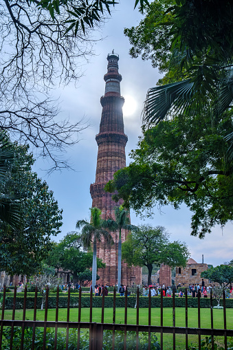 Delhi, India - March 11 2024: The Qutub Minar at Delhi India. The height of Qutub Minar is 72.5 meters, making it the tallest minaret in the world built of bricks.