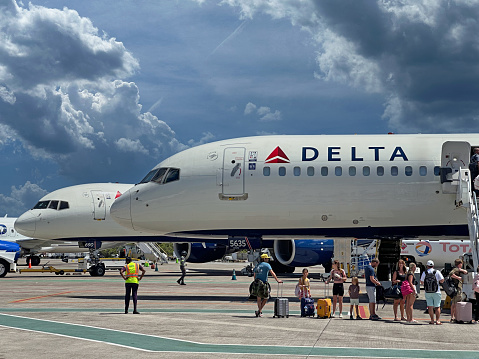 Passengers Boarding a Delta Airplane On the Tarmac at Cyril E. King Airport in US Virgin Islands on April 13th 2024.