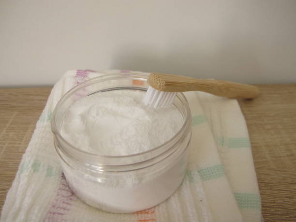 istock Tooth powder and a wooden toothbrush 2149963887
