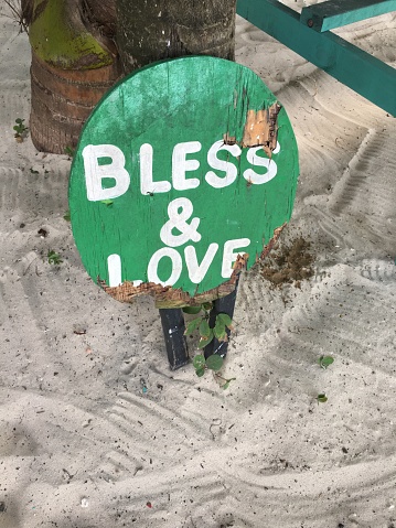 Bright positive sign on a sandy beach
