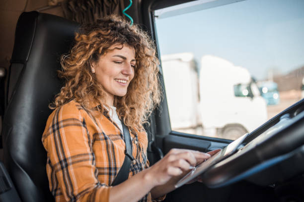 istock Female truck driver using tablet computer for navigation in transportation 2149966126
