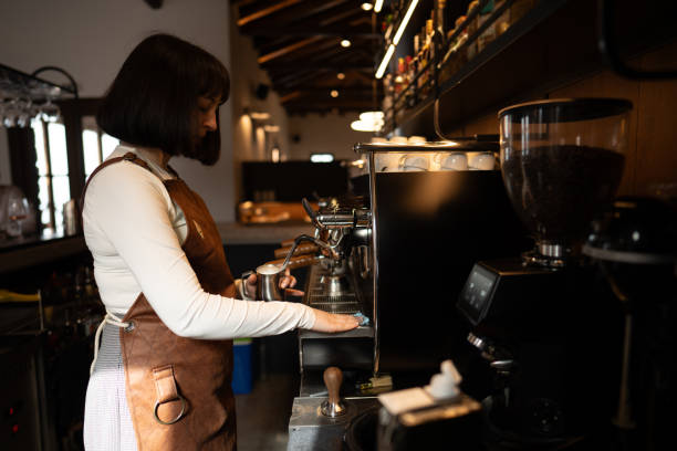 istock Female barista making coffee in a local cafeteria 2149966151