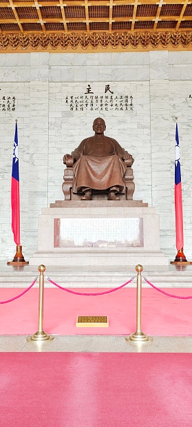 27-July-2023-The bronze statue of Chiang Kai-Shek,the former President of ROC on liberty square,located in Zhongzhen district, Taipei, Taiwan. The architecture of Chiang Kai-Shek Memorial Hall is inspired by Tiantan in Beijing. The four sides of the structure are similar to those of the pyramids in Egypt.