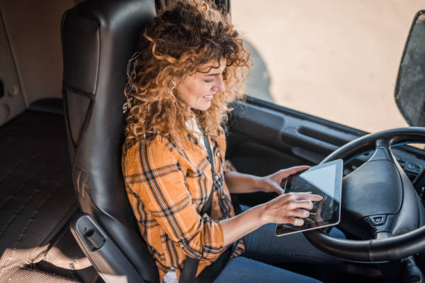 istock Woman truck driver using tablet computer for navigation in transportation 2149967274