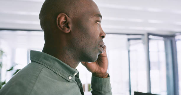istock Profile, black man and talking with phone call in office for project updates or client communication and decision making. Person, mobile and conversation for feedback or task development and advice. 2149967496