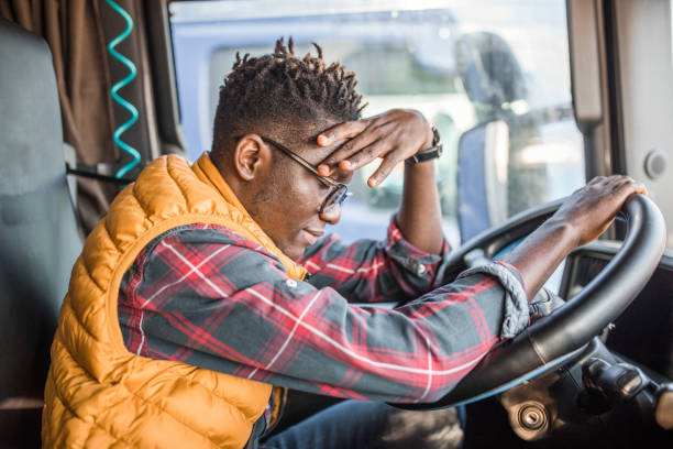 istock A black male trucker has a headache after working extra hours 2149968426