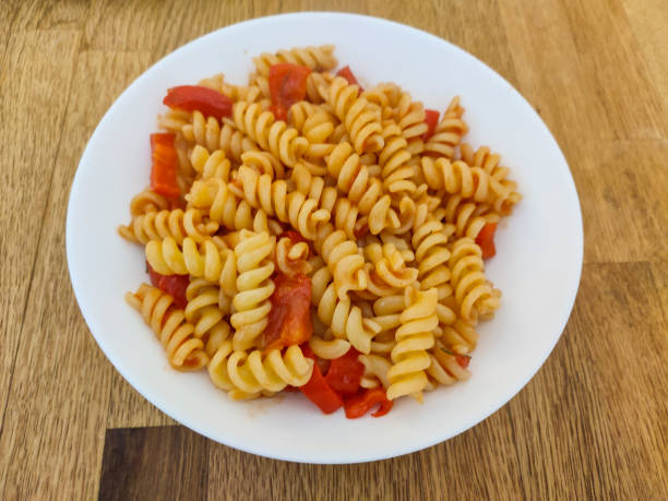 istock serving macaroni pasta at glasgow scotland england UK 2149968997