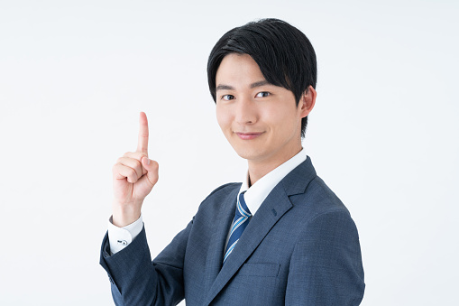 Young Japanese businessman on white background