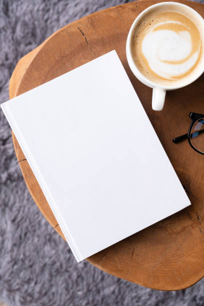 istock blank book mockup on coffee table with decorations and grey rug 2149978055