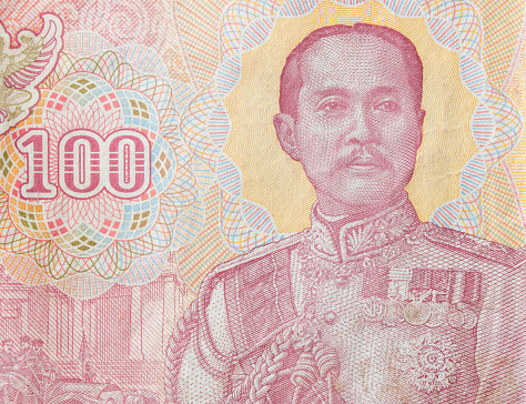 Portrait of the king on 100 Thai Baht.