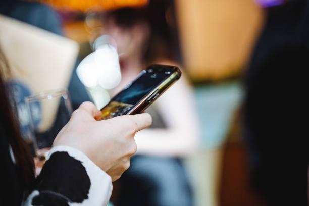 istock a person is holding a cell phone in their hand 2149981229