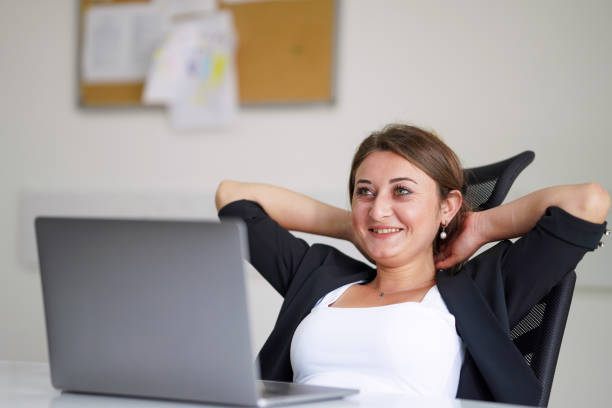 istock Portrait of woman feeling happy at work 2149981299