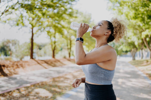 istock Fitness runner woman drinking water 2149981803