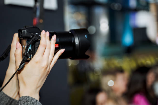 istock Photographer capturing event with digital camera lens 2149984875