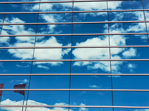 hotel bulding windows with sky reflections