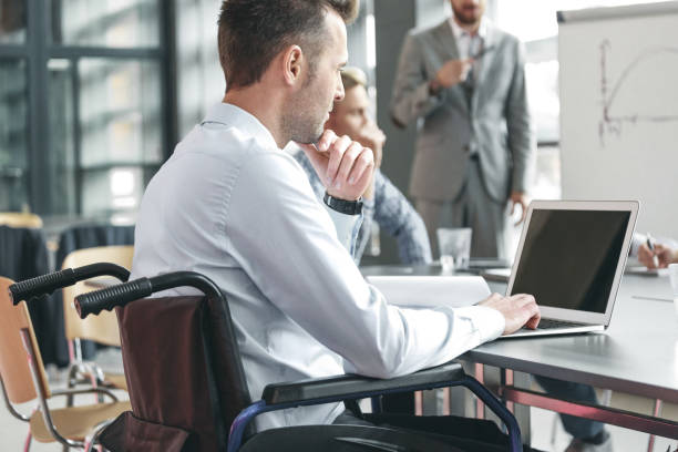 istock Disabled businessman working in an office 2149987095