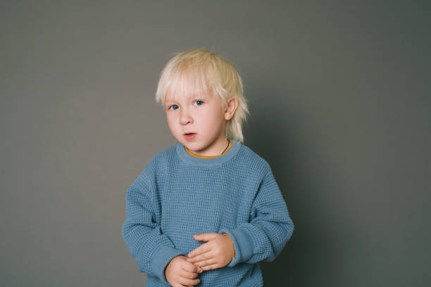 istock Studio portrait of adorable 4 -5 year old boy posing on grey background 2149988247