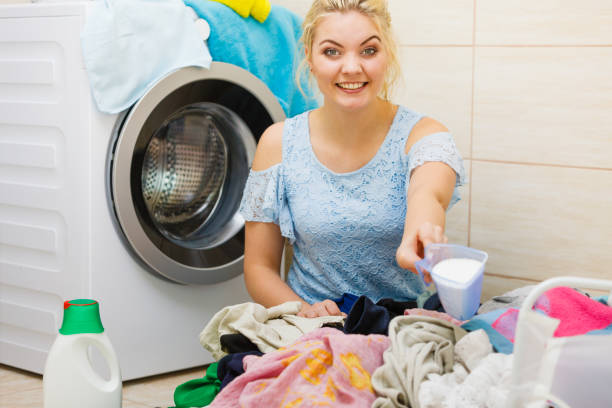 istock Woman wash laundry using powder detergent 2149988629