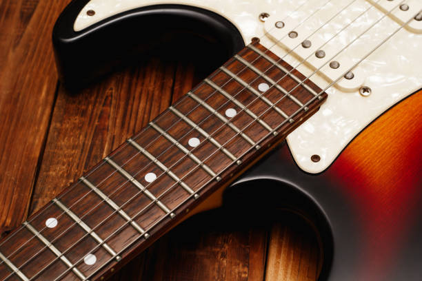 Closeup view of an electric guitar's body and neck