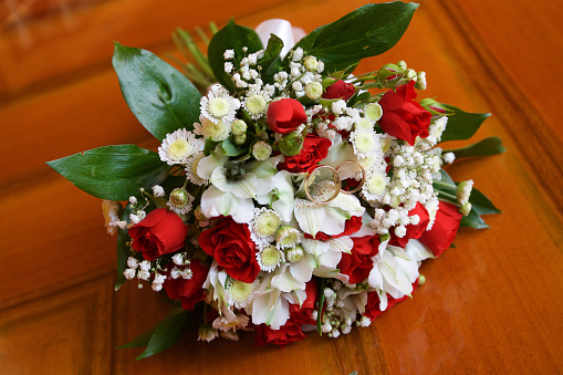 A bouquet of pink and white roses pictured from top