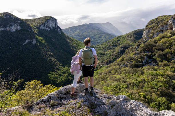 istock Friends look across mountains and valley from viewpoint 2149990785