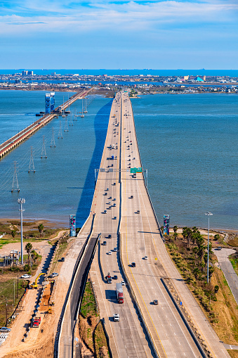 The Galveston Causeway linking Galveston Island with the Houston metropolitan area shot via helicopter from an altitude of about 600 feet on a sunny afternoon