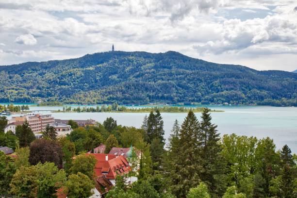 Worthersee mountain lake in Austrian Alps Worthersee mountain lake in Austrian Alps. Austria landscape in State of Carinthia. Town of Portschach am Worther See (Poertschach). pörtschach am wörthersee stock pictures, royalty-free photos & images