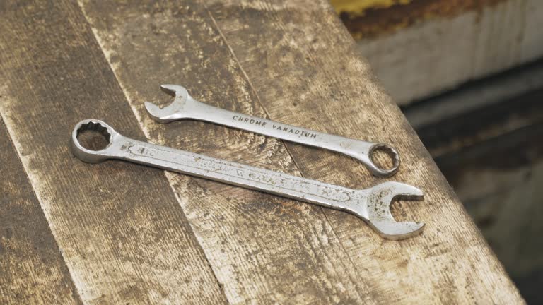 Two Wrenches on Wooden Plank