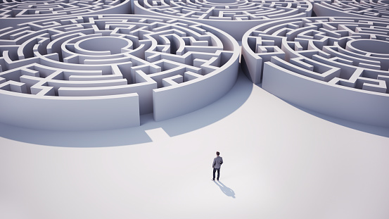 3d Render Businessman heading towards Circle shaped maze. Business and Finance Concept (Depth of Field)