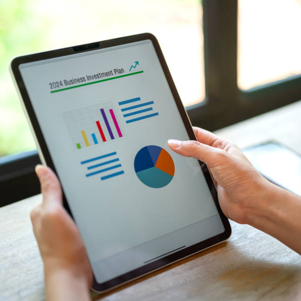 istock Working on business investment plan in tablet. 2149998143