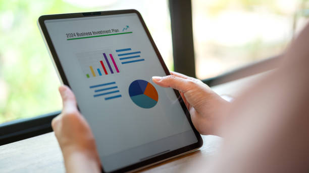 istock Working on business investment plan in tablet. 2149998153
