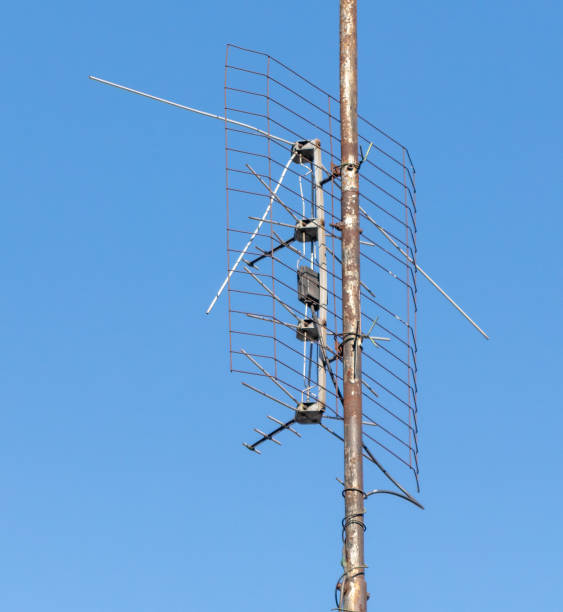 istock Old metal antenna against a blue sky 2149998850