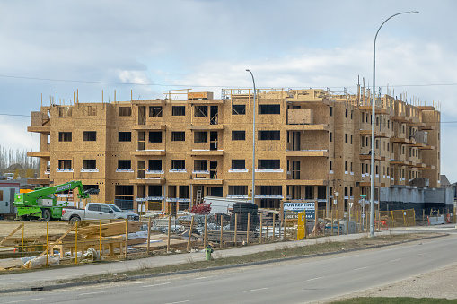 Calgary, Alberta, Canada. Apr 23, 2024. Construction of a new apartment complex underway.
