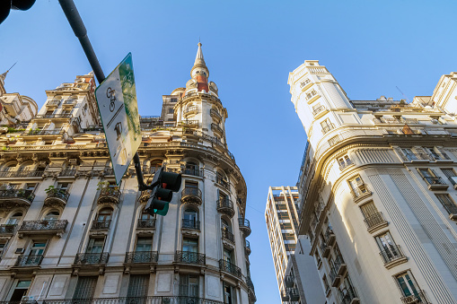low angle view on historic residential architecture in Buenos Aires against blue sky