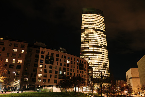 Modern apartment and office buildings in a city at night