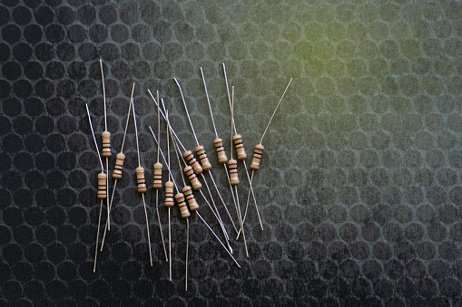Resistors are electronic devices that control the amount of current and voltage between two points in a circuit. Soft and selective focus.
